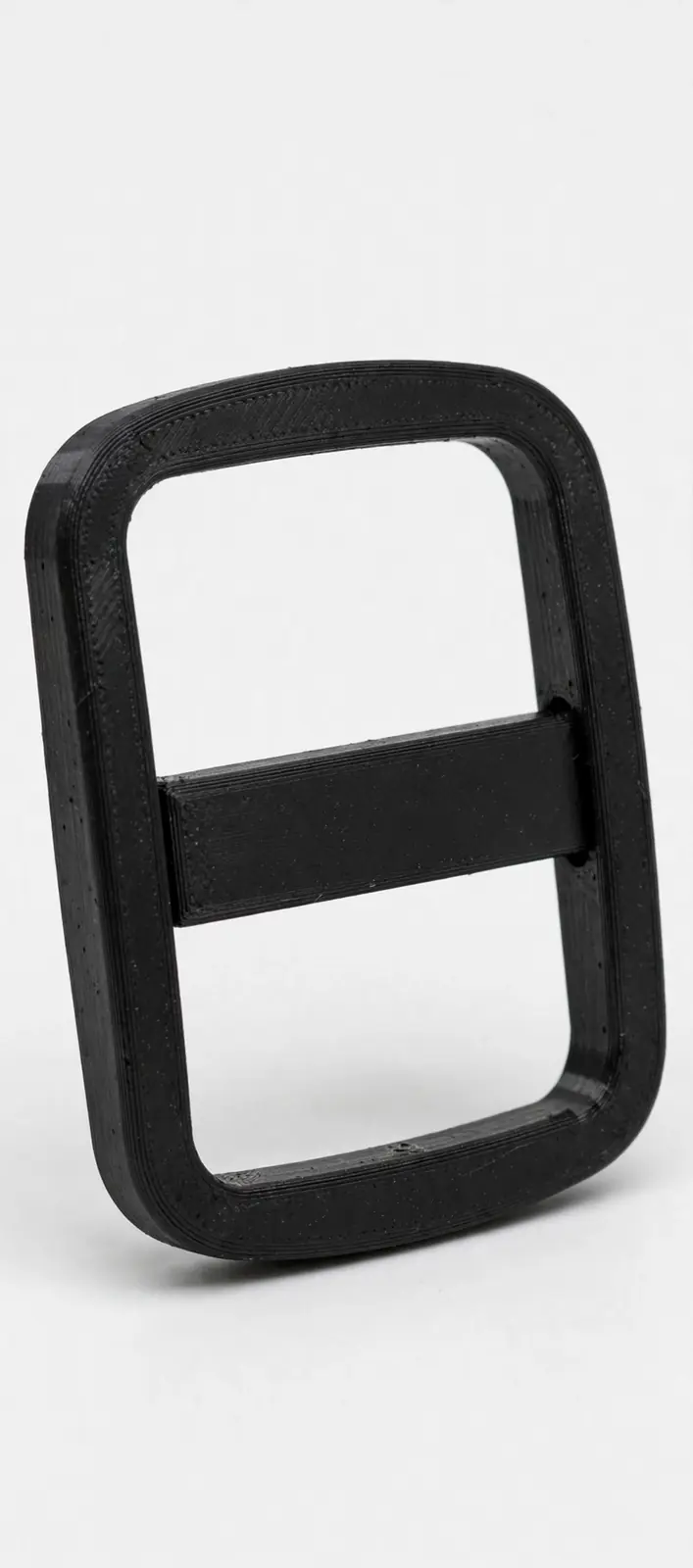 Black 3D-printed strap buckle — a rounded rectangular frame with one center bar forming two slots
